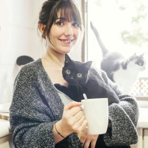 happy woman with cup coffee holding her cat 23 2147860403.jpg